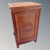 A contemporary Chinese cherry wood audio cabinet