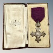 An MBE, George V Civil issue, hallmarked London 1918, in case.