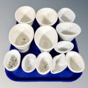 Twelve assorted cream ware jelly moulds, including Wedgwood examples, the earliest circa 1790,