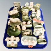 A tray of a collection ceramic pig dishes and vases