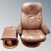 An Ekornes Stressless tan leather swivel relaxer armchair with stool