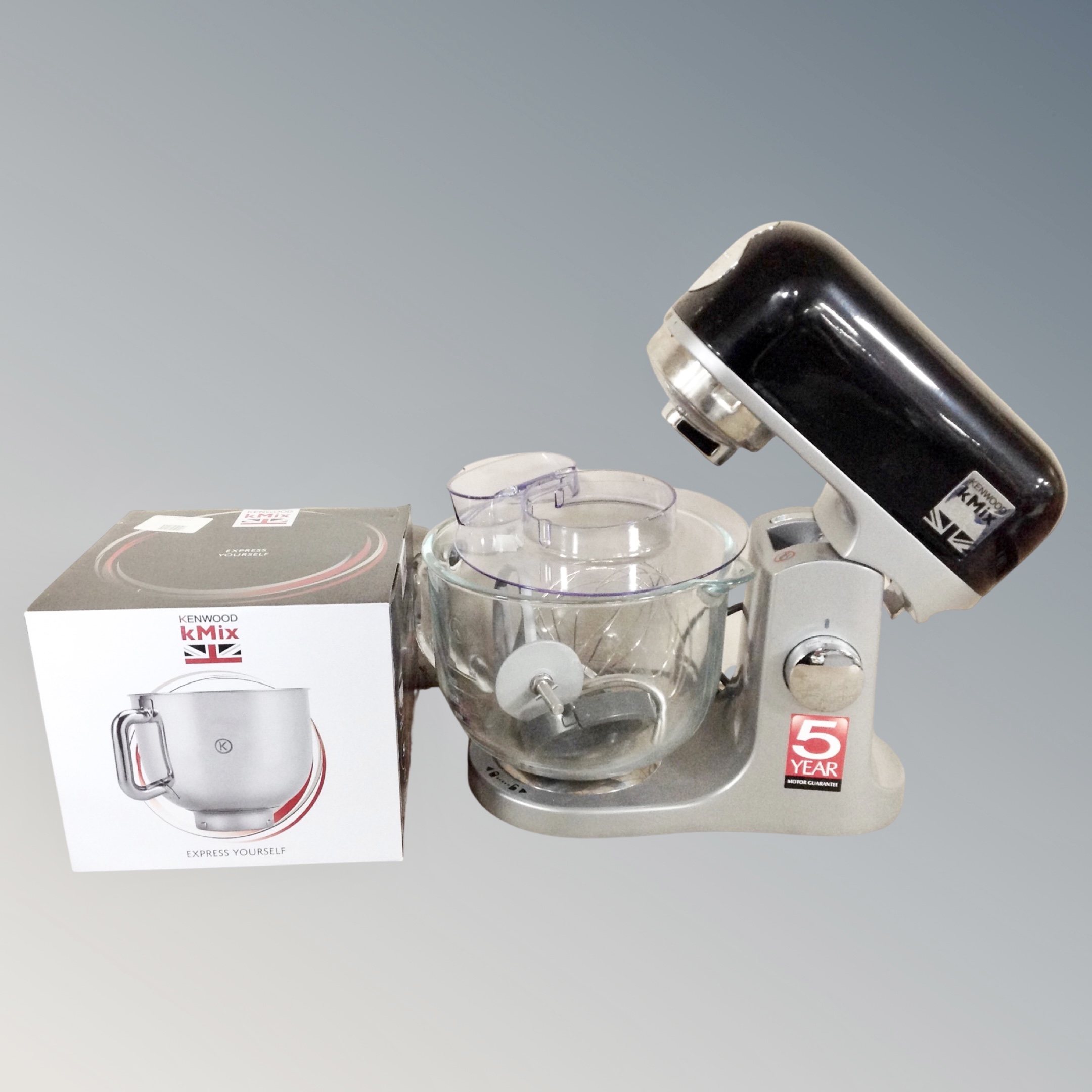 A Kenwood KMIX food mixer with accessories and boxed bowl