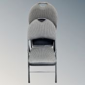 A pair of metal fabric upholstered folding chairs