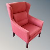A 20th century Scandinavian wingback armchair in red fabric
