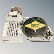 An Iris Gummed Tapes sealing machine and a vintage adding machine.