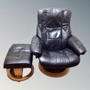 A Stressless black leather swivel relaxer armchair with stool