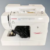 A Singer electric sewing machine with foot pedal