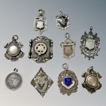 A group of mainly silver fobs