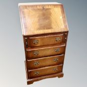 A reproduction bureau fitted four drawers