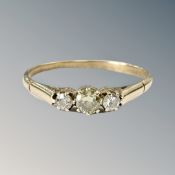 A yellow gold ring set with three small diamonds CONDITION REPORT: Hallmarks rubbed.