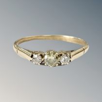 A yellow gold ring set with three small diamonds CONDITION REPORT: Hallmarks rubbed.