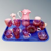 Eleven pieces of antique cranberry glass.