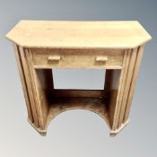 An Art Deco knee hole dressing table fitted a drawer