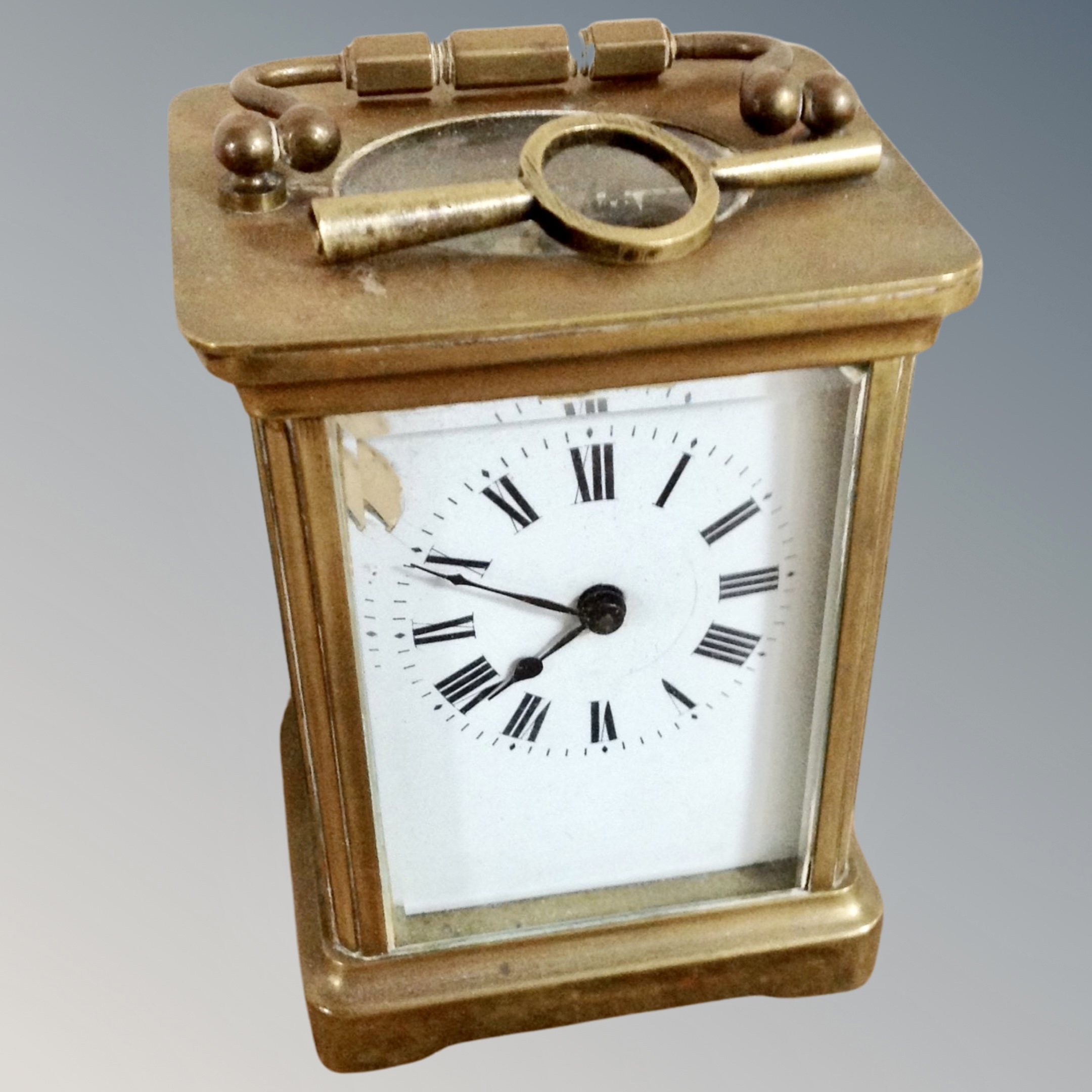 A brass cased carriage timepiece with key (dial af)