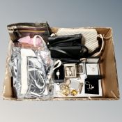 A box of lady's leather hand bags, fashion watches, costume jewellery,