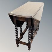 An Edwardian oak gate leg table