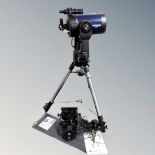 A Meade LX90 Schmidt-Cassegrain computerised high resolution telescope on field tripod with Condor