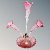 A cranberry glass three-branch epergne,