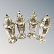 Four silver pepper pots, Sheffield 1936, 161.6g.