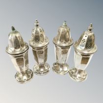 Four silver pepper pots, Sheffield 1936, 161.6g.