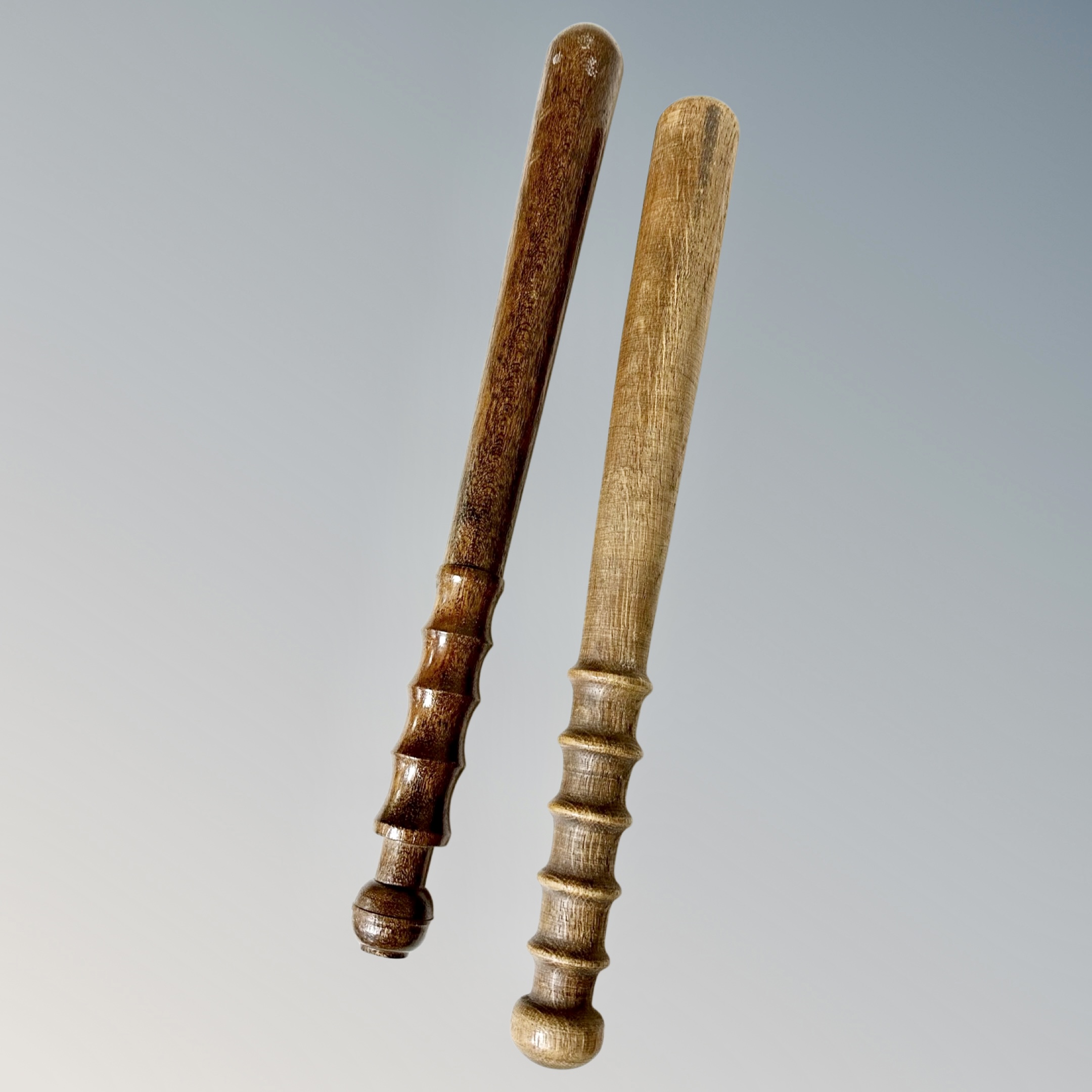 Two turned wooden police truncheons