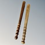 Two turned wooden police truncheons