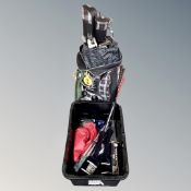 A golf bag containing assorted irons and drivers together with a further crate of golfing bag,