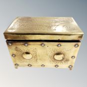 A decorative brass trinket box,
