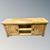 A contemporary solid oak entertainment low sideboard width 145 cm