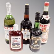 Five bottles of alcohol : Lamb's Navy Rum, Harvey's Pale Cream, Harvey's Bristol Cream,