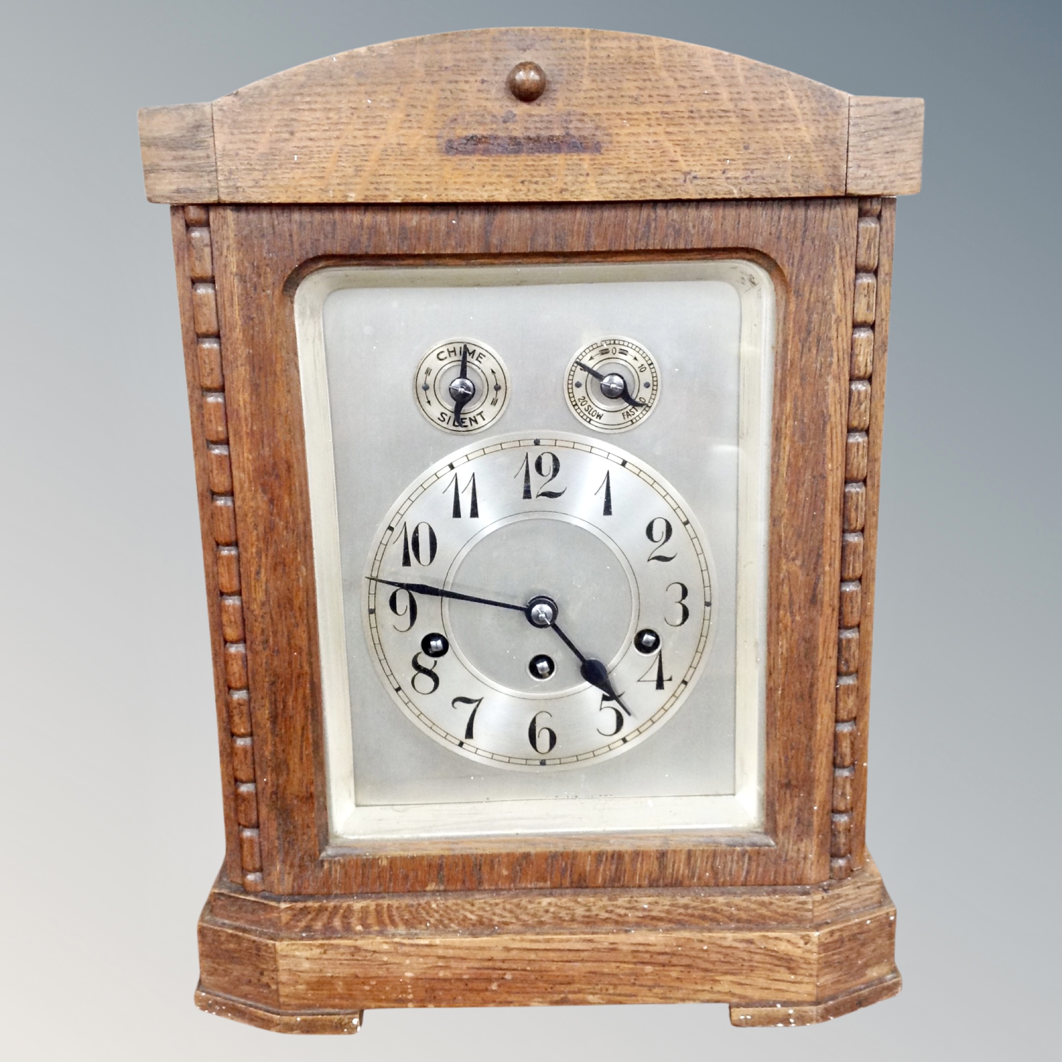 An early 20th century oak cased chiming bracket clock,