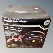 A Thrust-Master Ferrari GT experience computer steering wheel
