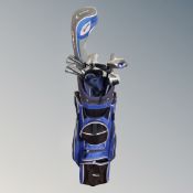 An Onyx golf bag containing a set of Wilson irons,