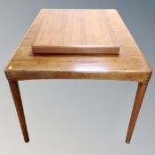 A Danish Bramin teak extending dining table with leaf