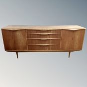 A 20th century teak cocktail low sideboard,