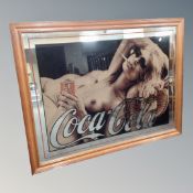 A Coca Cola advertising mirror depicting a reclining nude