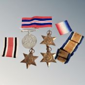 Four WWII medals on non matching ribbons : The defence medal, 1939/45 star,