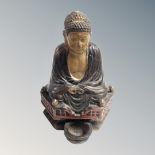 An Eastern pottery Buddha statue,