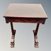 A mahogany and beech side table fitted with a drawer on lion paw feet,