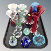 Contemporary coloured glass paperweights, glass vases, drink glasses,