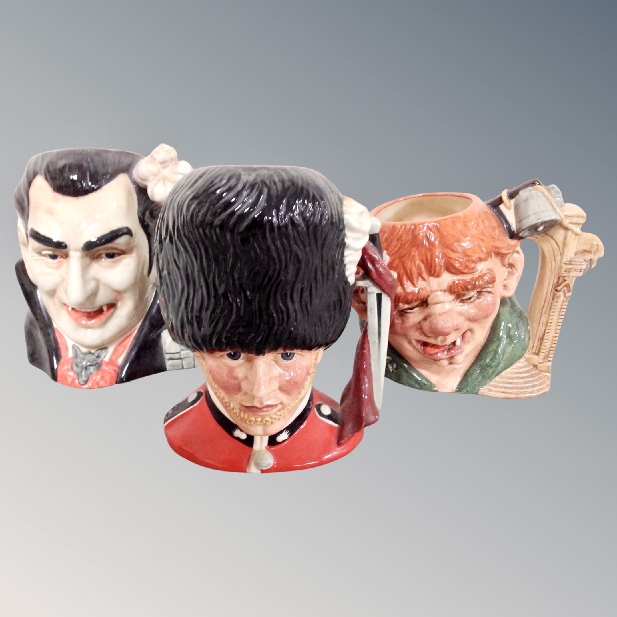 Three Royal Doulton character jugs : Count Dracula, The Guardsman,