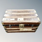 An antique metal bound shipping trunk