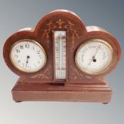 An Edwardian inlaid mahogany combination clock/thermometer/barometer,