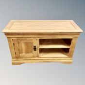 A contemporary solid oak entertainment stand width 100 cm