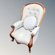 A Victorian carved walnut armchair