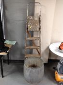 A vintage galvanized wash tub together with a set of folding wooden step ladders