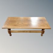 An oak refectory low coffee table,