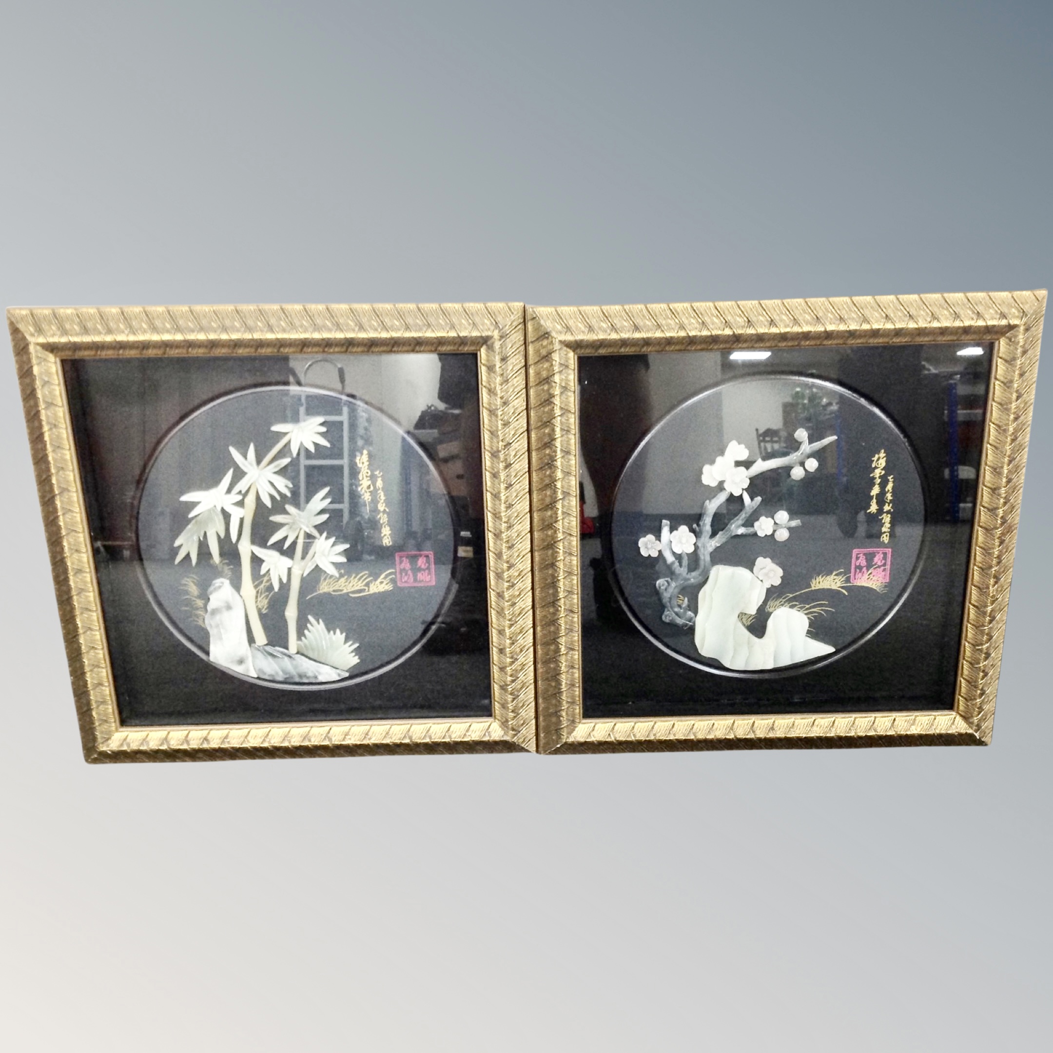 A pair of Chinese jade relief panels in frames