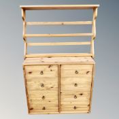 A pine eight drawer chest and similar wall rack