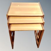 A teak nest of three tables